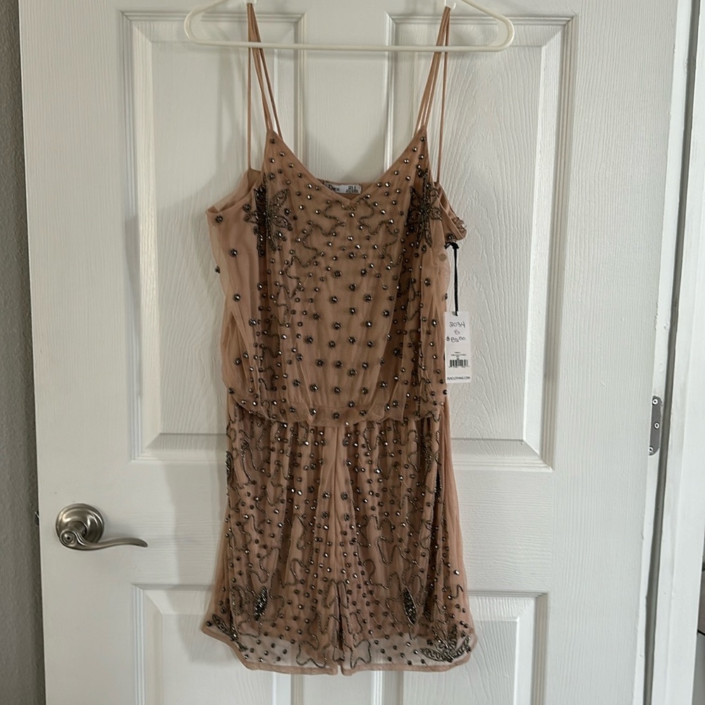 Beautiful beaded neutral color romper.